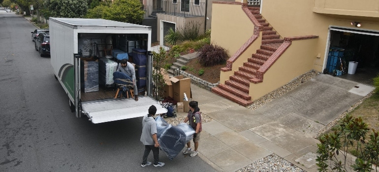 Menlo Park movers putting items into a truck