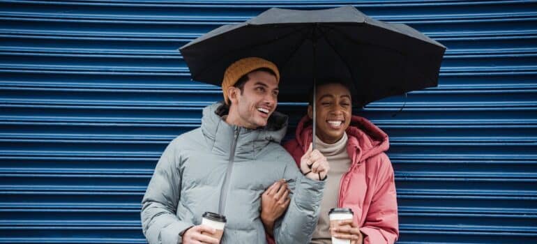 happy couple with an umbrella