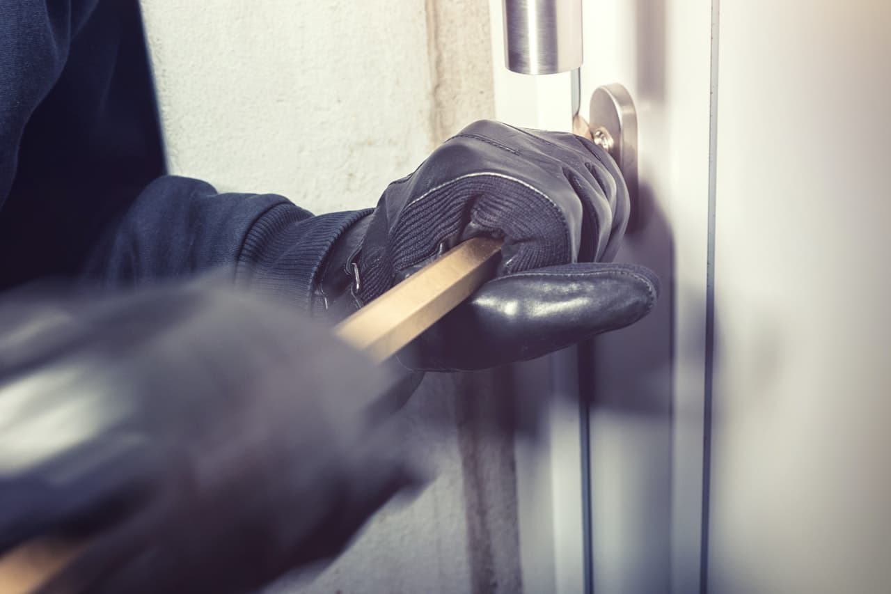 A thief trying to pick a lock