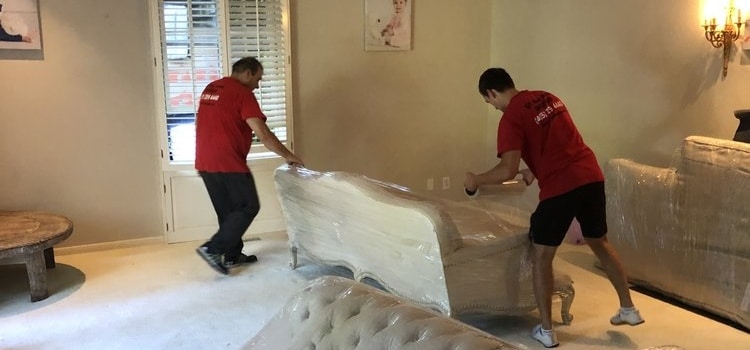 Movers packing furniture to prepare for a senior move in San Francisco