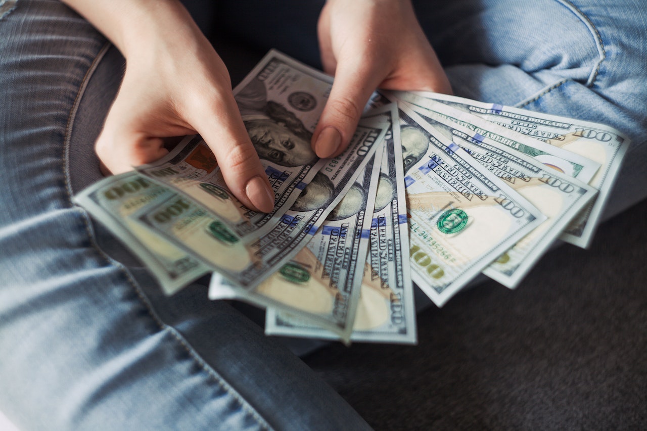 A person holding dollars