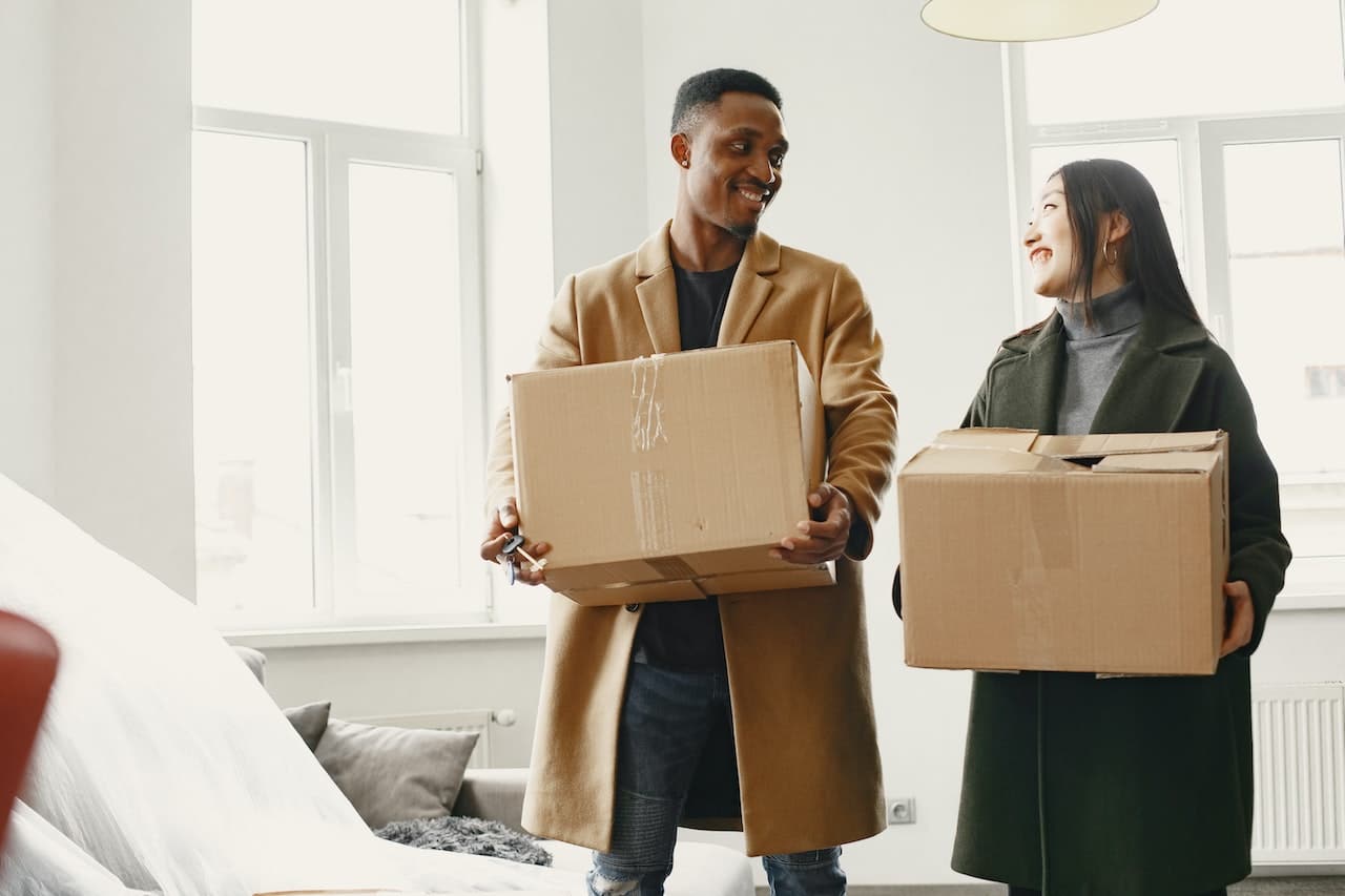 Picture of a couple with boxes